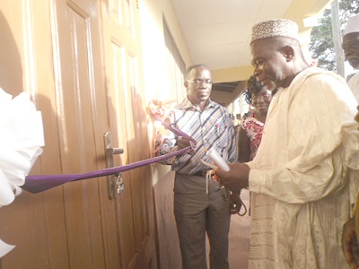 The Konongo Zongo Chief,  Alhaji Abdul Rahim, cutting the tape to inaugurate the project. With him is Dr Ogborjor (left).