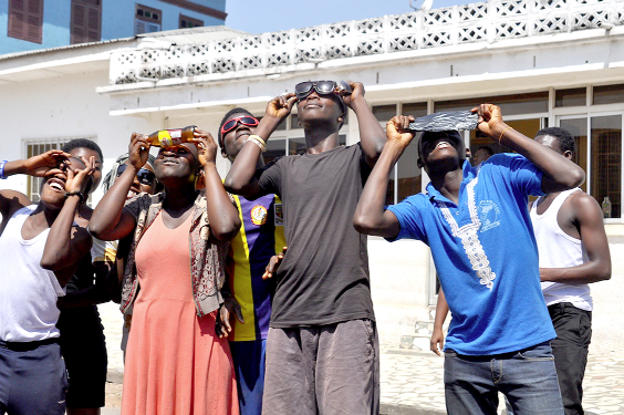 Some residents of Kumasi watching the Eclipse. Picture:  J. K. Essel