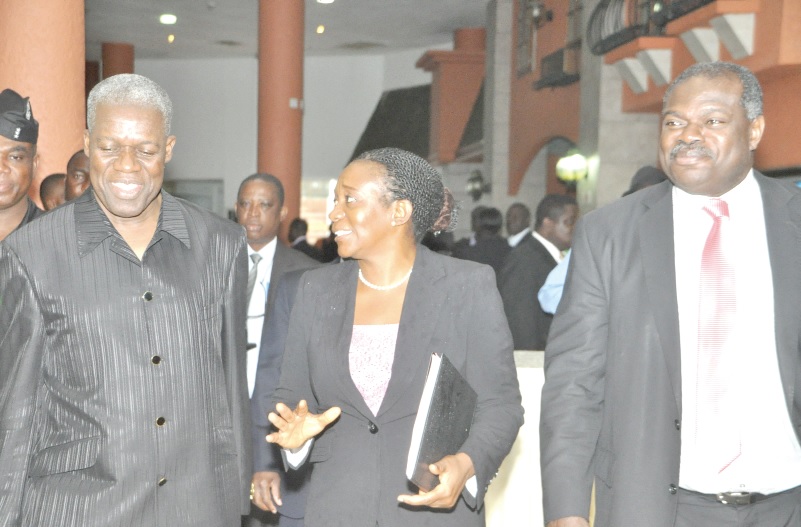 Dr Alberta C. Hagan (middle), of the Bank of Ghana explaining a point to  Vice President Kwesi Amissah Arthur (left), at the 18th annual conference organised by the Department of Economics of the University of Ghana in Accra. With them is Professor Ernest Aryeetey, Vice-Chancellor of the University of Ghana, Legon. 