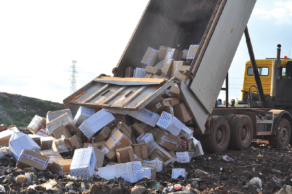 Some unwholesome products being offloaded at the site to be destroyed