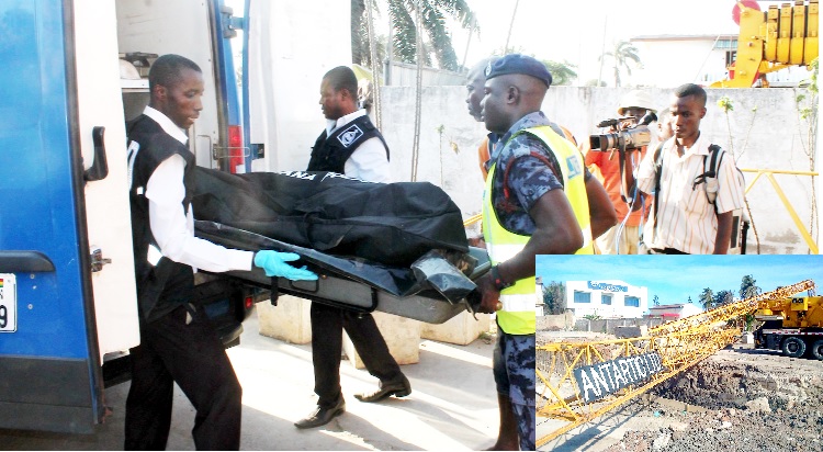 Policemen conveying the body of the deceased away from the scene of the accident. INSET: The collapsed crane on which the deceased was working.
