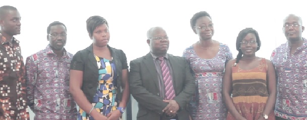 Officials of the savings  and loans company with  some of the beneficiaries.