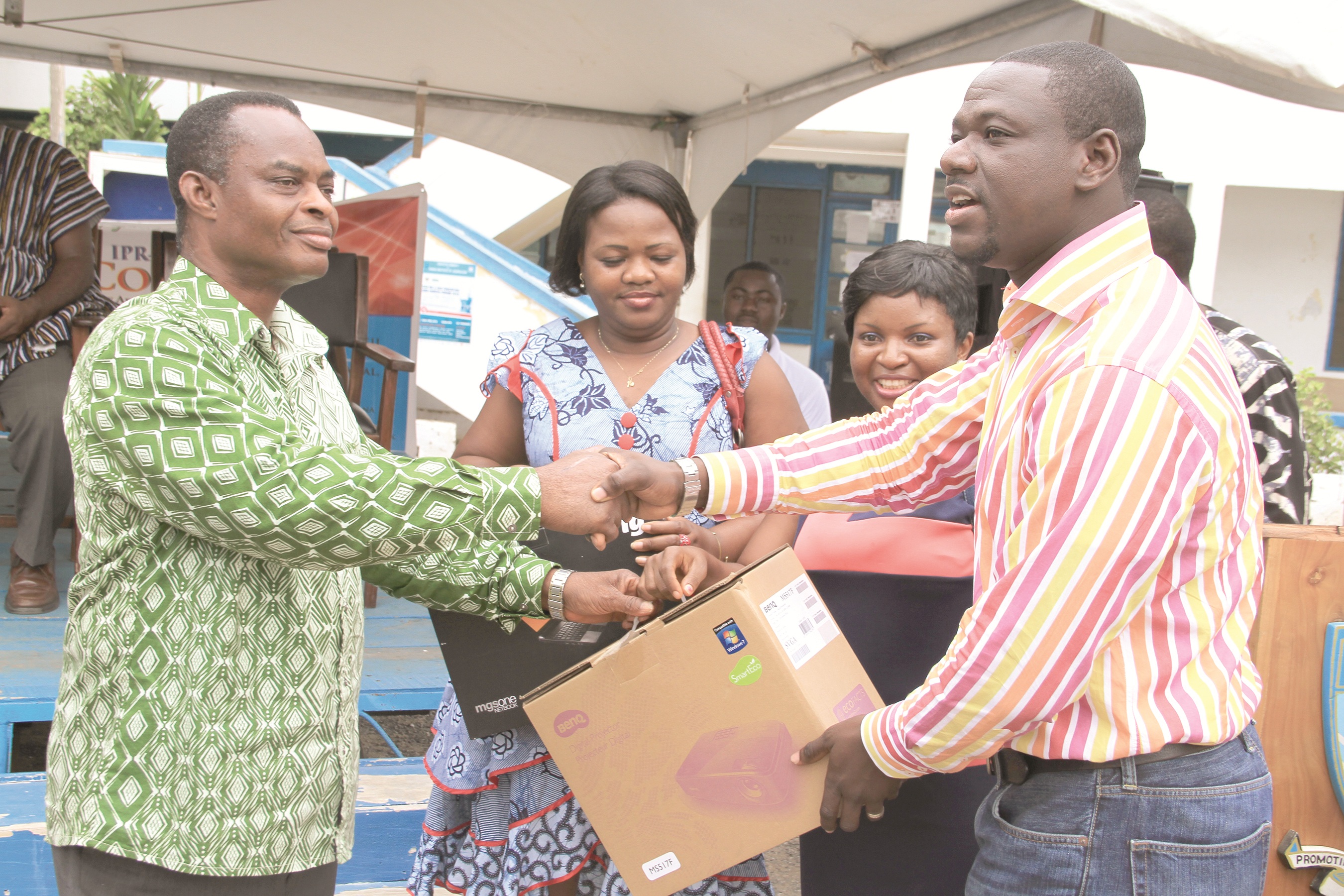 Pix 2: Mr Akwasi Sarpong of the BBC making the presentation on behalf of the GIJ 2000 year group to the Rector, Mr David Newton. Looking on are two members of the alumni Ms Ruby Mensah of MTN Ghana and Mrs Rebecca Quaicoe-Duho of the Daily Graphic. 
