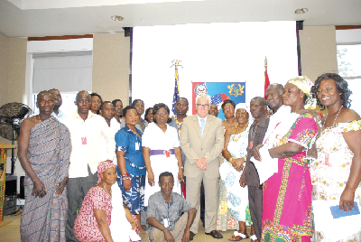 The US Ambassador (arrowed) in a group photograph with the beneficiaries after the award ceremony.
