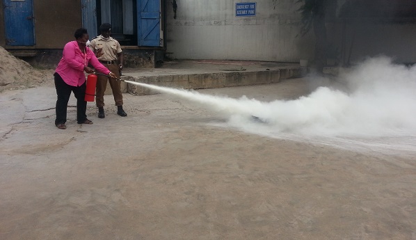 A staff of GCGL being trained to use a fire extinguisher