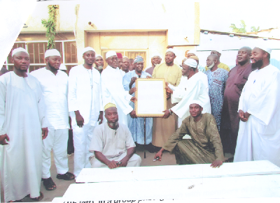 Hajj Yakubu Batalima (4th left), in a group photograph with members of the Ahlussuna Wal Jama’a at the presentation ceremony