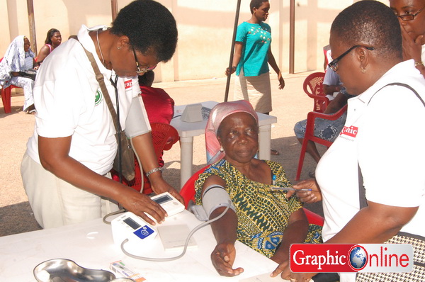 Medics attending to a patient during the free health screening.