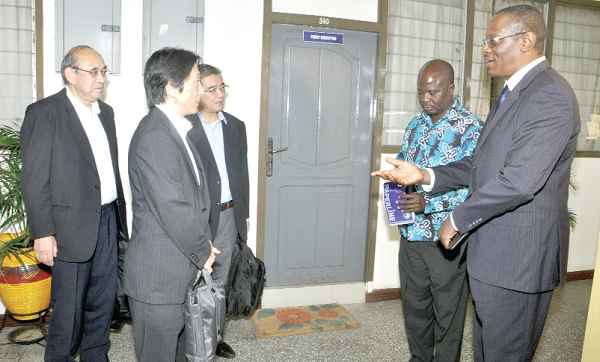 Mr Leslie  Tamekloe (right)  interacting with Mr Keisuke Alita (2nd left), Mr Yoshio Yoshida (right), and  Mr Hiroto Itagaki, both of  Tokyo Electric Power Service  Company Limited after the meeting in Accra. Picture: GABRIEL AHIABOR