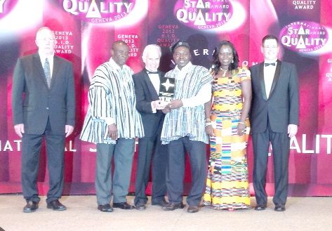 Mr Michael Aidoo (3rd right)  receiving the award from Mr Prieto.  With them are officials of Business Initiative Directions and KAAF University
