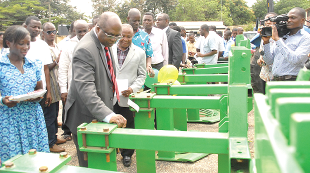 Mr Kofi Humado (left), Minister of Food and Agriculture, and other officials from MOFA, inspecting the KNUST-manufactured cassava harvesters at a ceremony at the AESD in Accra. Picture: Samuel Adjei-Boateng