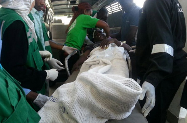 One of the victims of the accident is carried into an ambulance at Mutindwa on October 30, 2013.