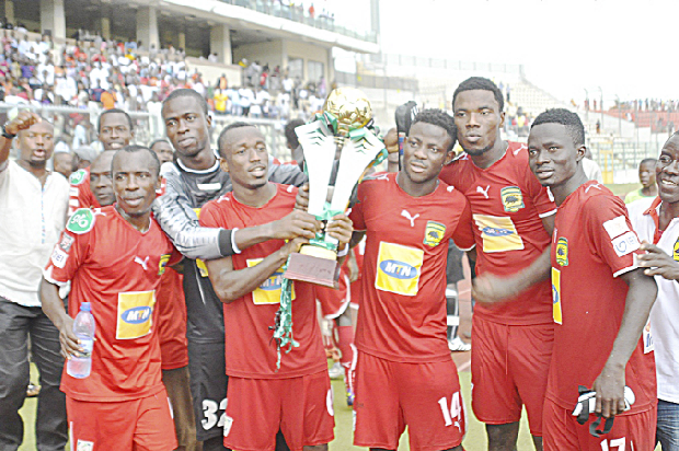 • Skipper Michael Akuffo (with cup) celebrating with his teammates.