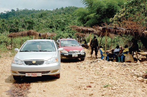 Two vehicles allegedly belonging to the Chinese parked in front of their dwelling place at the mine.