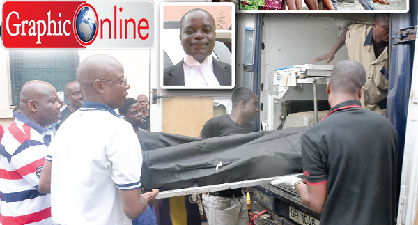 Personnel from the Criminal Investigations  Department (CID) of the Ghana Police carrying the body of Kofi Yawson-Adjei to the Police Hospital mortuary. Pictures: SAMUEL TEI ADANO