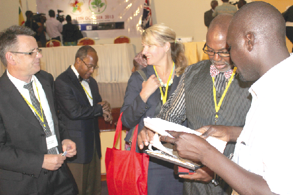 Mr Christopher Kewley (left) ,Faculty of Health and Medicine, University of Newcastle, Australia, interacting with some participants after the conference in Accra. Picture: EDNA ADUSERWAA
