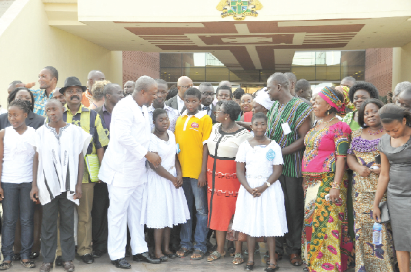President Mahama interacting with the marginalised groups after the meeting at the Flagstaff House in Accra. Among them are some ministers of state. Picture: EBOW HANSON