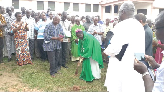 The Most Rev. Joseph Osei-Bonsu breaking the ground for the construction of the Marshallan Business Complex.