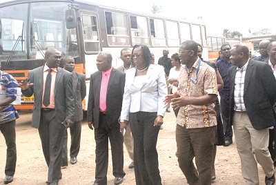  Mr Ebenezer Allotey (2nd right), acting Technical Manager,  Metro Mass Transit Limited (MMT), explaining a point to  Ms Dzifa Attivor, during her visit to the MMT Head Office in Accra. With them include Mr Noble Appiah (right), MD of MMT. Picture: EMMANUEL BAAH 