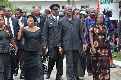 Mrs Naadu Mills acknowlwdges greetings from some invited guests as she makes her way to the Asomdwee Park in the company of Vice President Amissah-Arthur and his wife  Pictures: EBOW HANSON