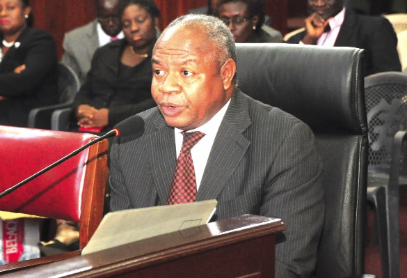 Mr Frederick Boniface Senahia, Senior Manager, State Enterprises Audit Corporation, answering questions during the judgement debt commission sitting in Accra. 