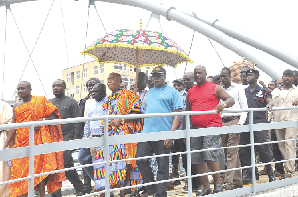 Alhaji Amin Suleimana (second right), Minister of Roads and Highways and some invited guests inspecting the bridge after the inauguration. With them include Baffour Asare Owusu Amankwatia IV, Banatamahene. 
