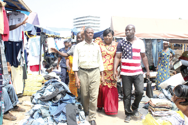 Nana Oye Lithur (middle), Minister for Gender, Children and Social Protection, touring the market with Mr Okyere Atta-Baffour (left), Chairman of the Shoe Sellers Assoiation at Kantamanto, and Mr Obour (right), Chairman of the Second-hand Cloth Dealers Association, also at Kantamanto. Picture: EDNA ADUSERWAA
