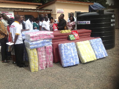 Rev. Daniel Sackey (2nd right), Resident Pastor,  Pentecost International Worship Centre (PIWC), making a remark during the presentation of the items to the hospital. With them is Mr Isaac Mensah (4th right), the Administrator of the Accra Psychiatric Hospital in Accra. Picture: Emmanuel Baah