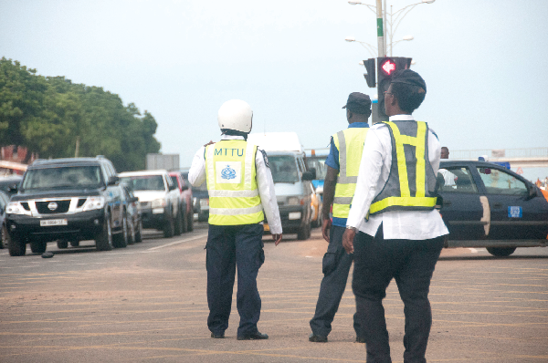  Some officers of the Ghana Police Service controlling traffic in Accra