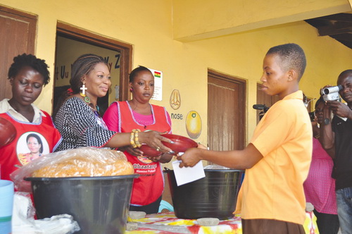 Mrs Pokuah Sawyerr serving one of the BECE candidates  with a bowl of rice
