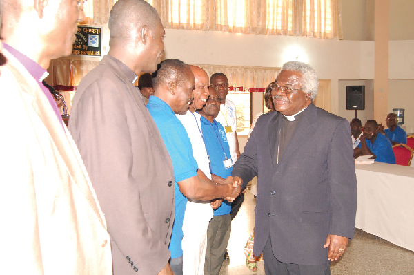 Rt. Rev. Professor Emmanuel Mantey (right), Moderator of the Presbyterian Church of Ghana, congratulating the New Board of Trustees for the Prisons Ministry.  Picture: Emmanuel Asamoah Addai