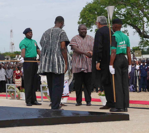 President Rawlings pats Martin Amidu at the 2013 celebration of the June 4 revolution.