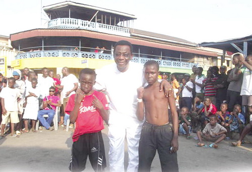 • Ambassador Ray Quarcoo (middle), with some of the kid boxers