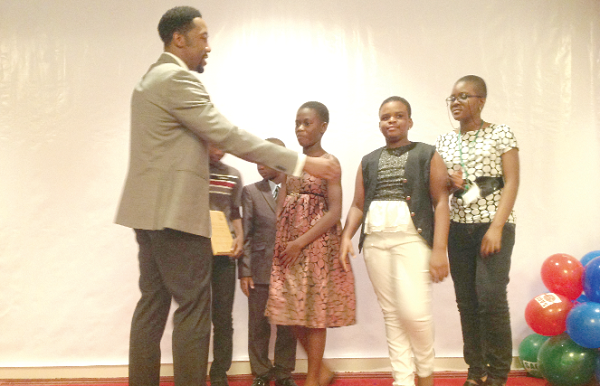 The SAGE team of the Early Bird School  with the grandson of President Nelson Mandela, Madiba Mandla, who presented the award to them.