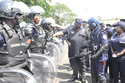  Mr Mohammed Ahmed Alhassan (3rd right), the Inspector General of Police,  inspecting some riot control equipment  during the formal launch of the reorganised Formed Police Unit (FPU) in Accra. Picture: GABRIEL AHIABOR