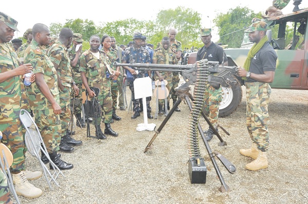 Students from the Ghana Armed Forces Command & Staff College, havinga look at the deactivated 12.7mm DSHK heavy machine gun.