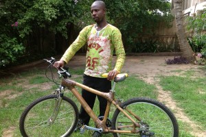 Danso displaying one of the bikes he manufactures