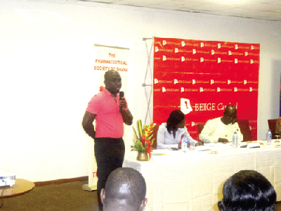 Mr Mike Nyinaku (standing), speaking to the pharmacists during the programme