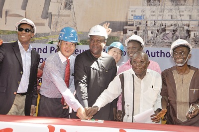 President John Mahama (middle) being assisted by Mr I. K. Adjei-Mensah (2nd right), Board Chairman of Bui Hydroelectric Project, and other officials to inaugurate the first Generation Unit of the Bui Hydroelectric Project. Picture: GABRIEL AHIABOR