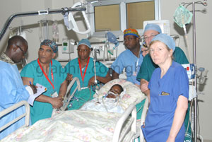 Some members of the medical team with one of the patients at the Intensive Care Unit after the operation talking to our reporter - George Ernest Asare (extreme left)