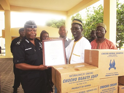Alhaji Oti-Boateng (2nd right), presenting a citation to COP Oppong-Boanuh