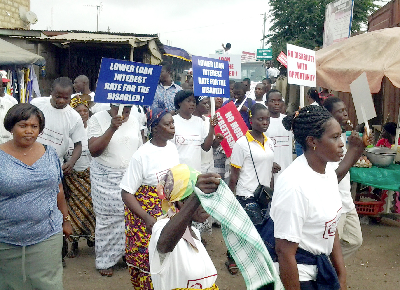 A section of persons with disability exhibiting placards as they walked through some principal streets of Kasoa.