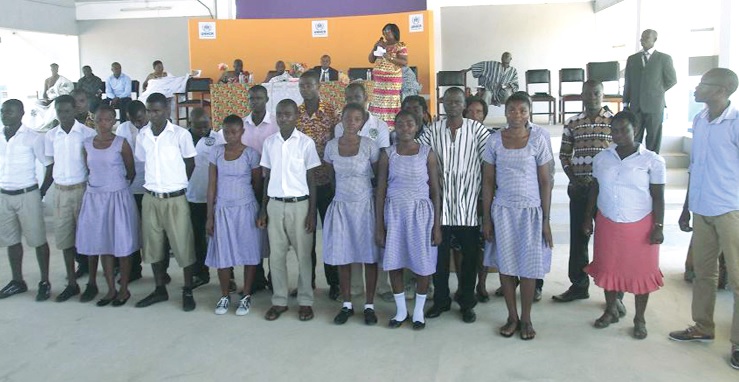 The pioneer students and staff being introduced to the gathering during the ceremony.