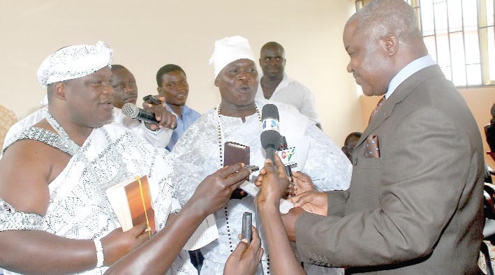 Nii Ayi Bonte II(left), Gbese Mantse and Numo Ogbame III, Sakumo Wulomo, being sworn in by Mr Mustapher Habib Logoh (right), a High Court Judge.