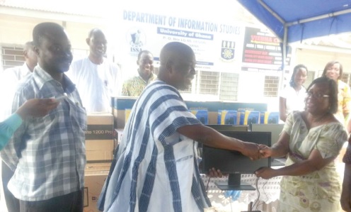 Prof. Perpetual Dadzie (right) receiving the items from Kofi Attor, CEO of GIFEC, while some staff of the department and GIFEC look on.