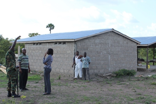 A Soldier in a chat with some developers around the airstrip