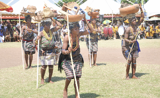 Some women carrying the 37 articles of the Anlo State and performing the  Husago dance.