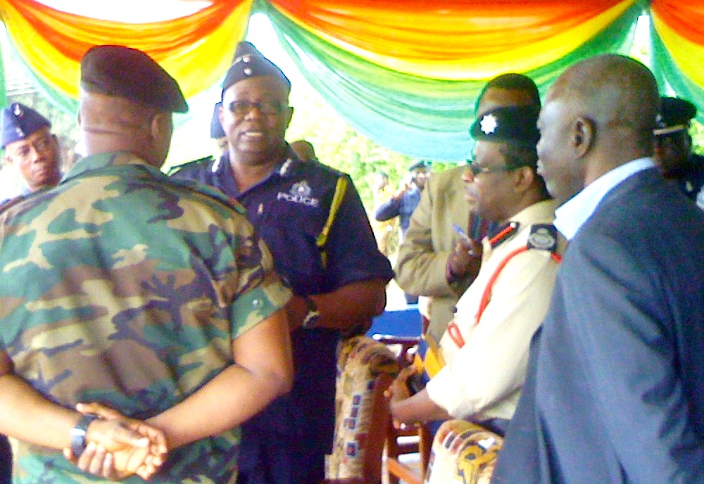 The Inspector-General of Police, Mr Mohammed Alhassan (middle and facing camera), interacting with the various sectional commanders of the security services during his visit to Ho.
