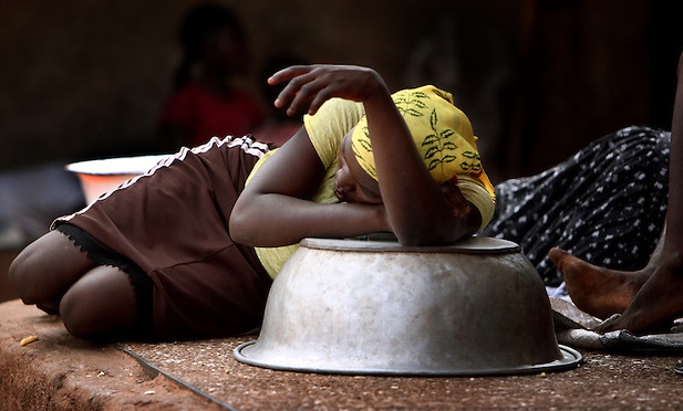 A kayayoo taking a nap at the market