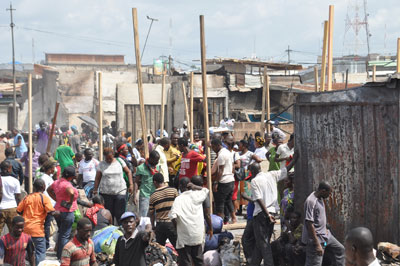 Traders at the Kumasi Central Market affected by Sunday's fire outbreak begin to reconstruct their shops