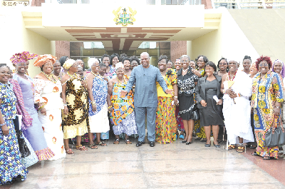 President Mahama in a group photograph with some members of the women groups after the meeting at the Flagstaff House in Accra. Picture: EBOW HANSON